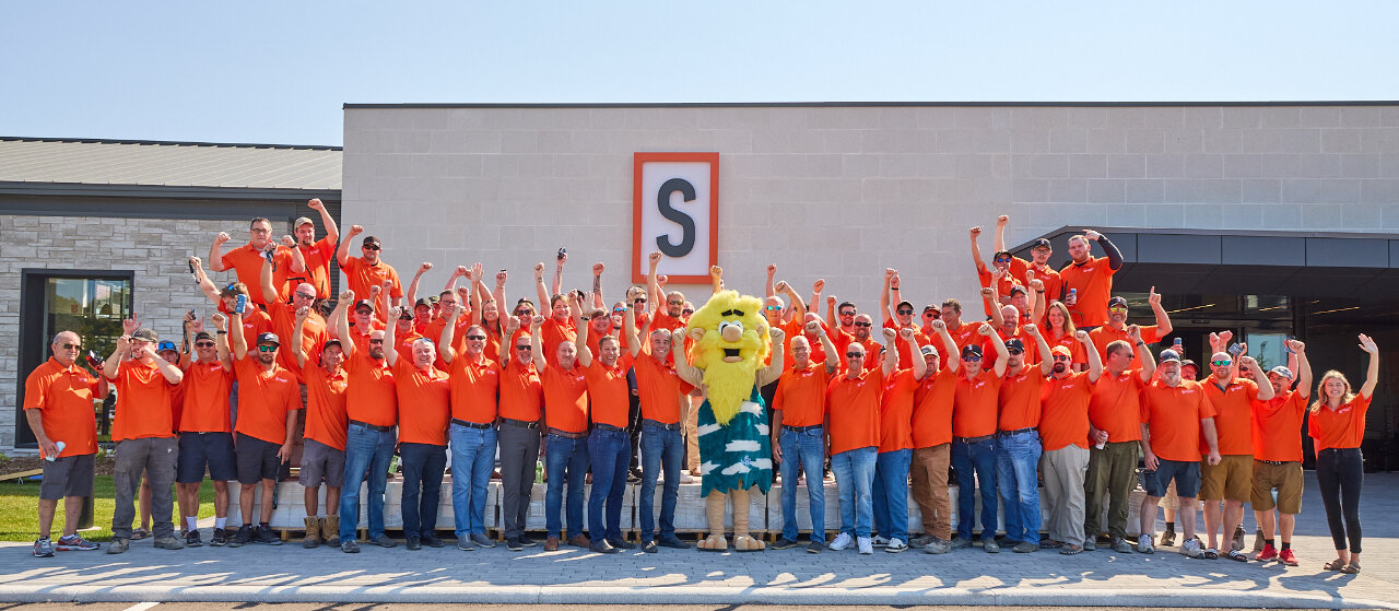 A group of smiling Shouldice Stone employees